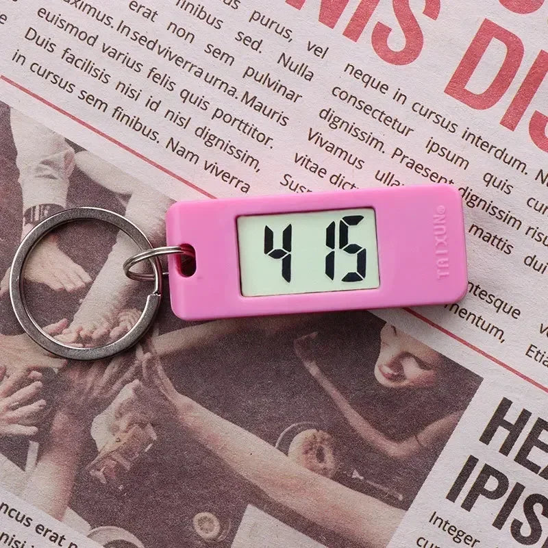 2025 Mini Electronic Clock Keychain - Elliptical, Digital Display. Ideal for students. Features LED time readout