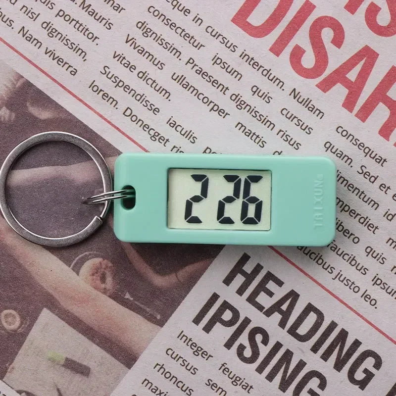 2025 Mini Electronic Clock Keychain - Elliptical, Digital Display. Ideal for students. Features LED time readout