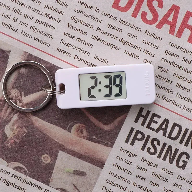 2025 Mini Electronic Clock Keychain - Elliptical, Digital Display. Ideal for students. Features LED time readout