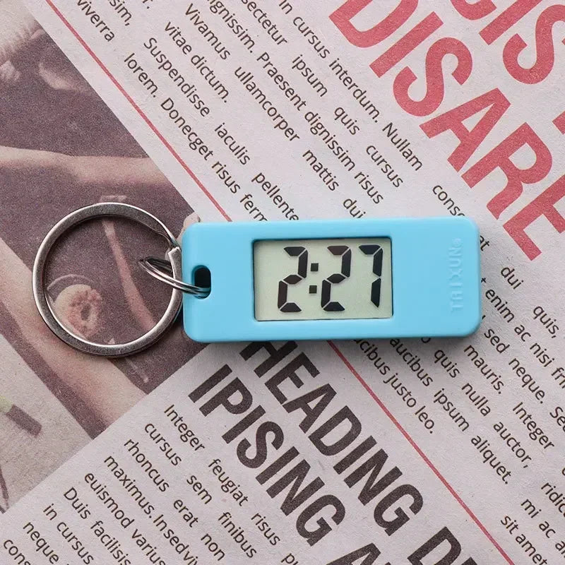 2025 Mini Electronic Clock Keychain - Elliptical, Digital Display. Ideal for students. Features LED time readout