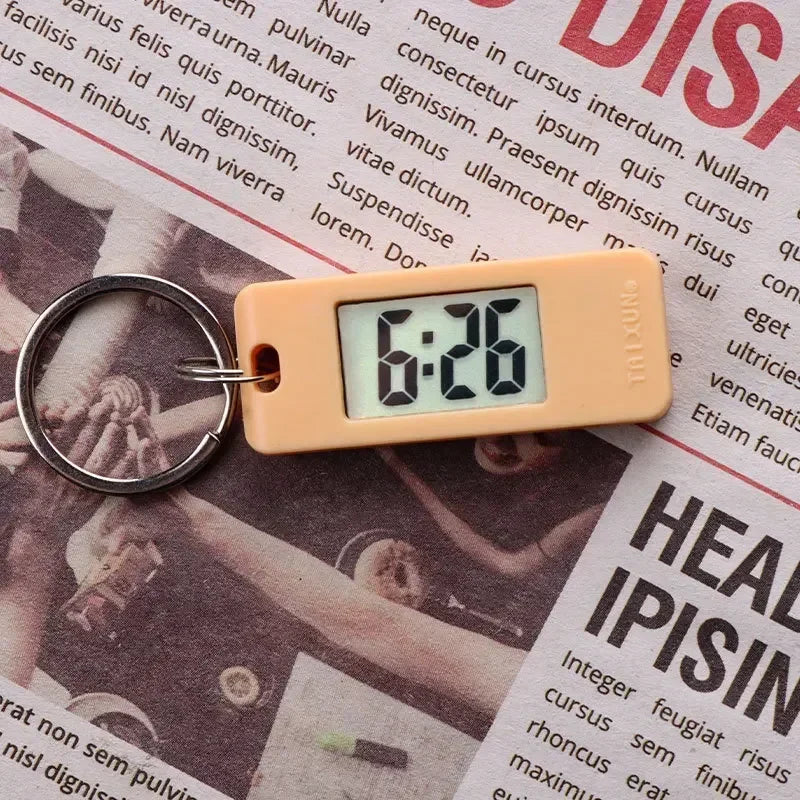 2025 Mini Electronic Clock Keychain - Elliptical, Digital Display. Ideal for students. Features LED time readout